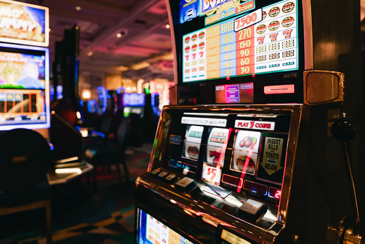 Rows of slot machines lit in different colours